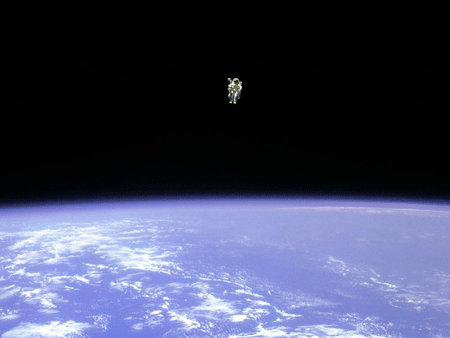 man floating free in space